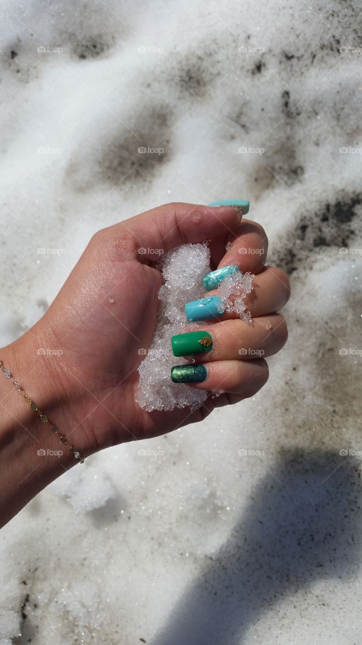 green and turquoise nails in snow