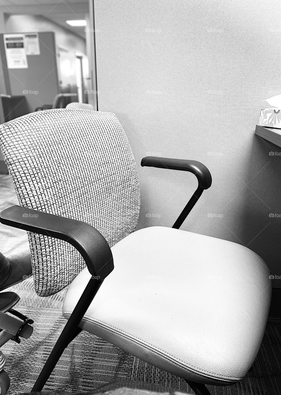 Empty office chair back and white setting 