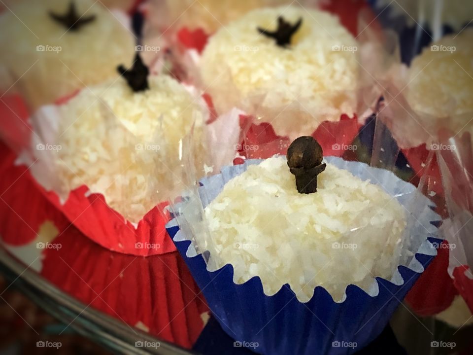 “Beijinhos” - a traditional Brazilian sweet made of coconut and condensed milk. In a literal translation, it’s name would be “Little Kiss”, but I believe it is know as “little coconut cakes”.