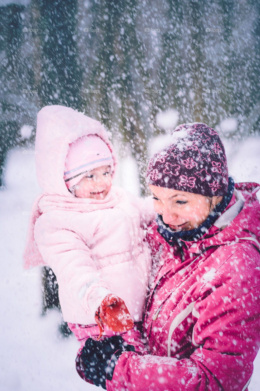 Winter with friends. Spending wintertime outdoors playing with snow