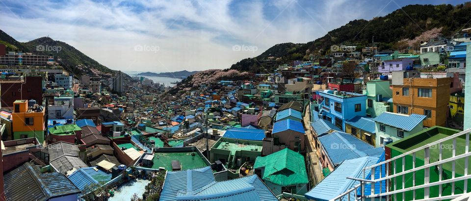 Panoramic view of a village with clear blue sky