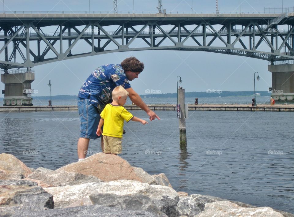 pointing at the water