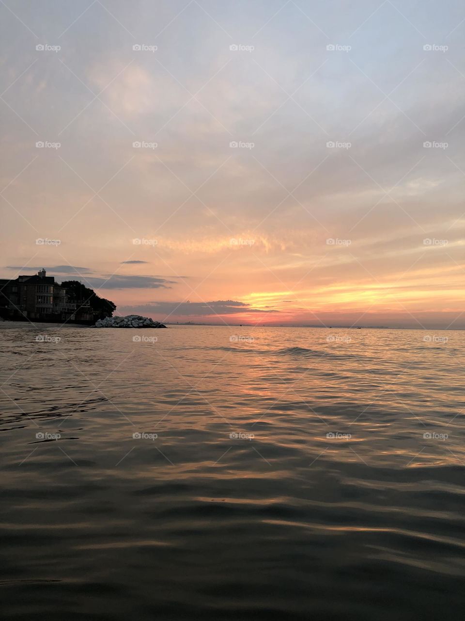 Sun going down with brilliant lite mirror reflecting the sun