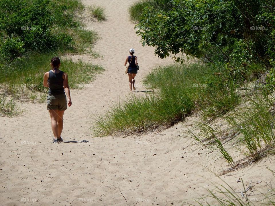 People hiking. Sand dunes 