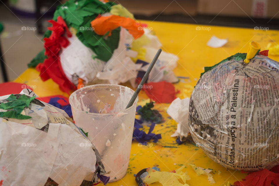 making a piñata with recycled paper