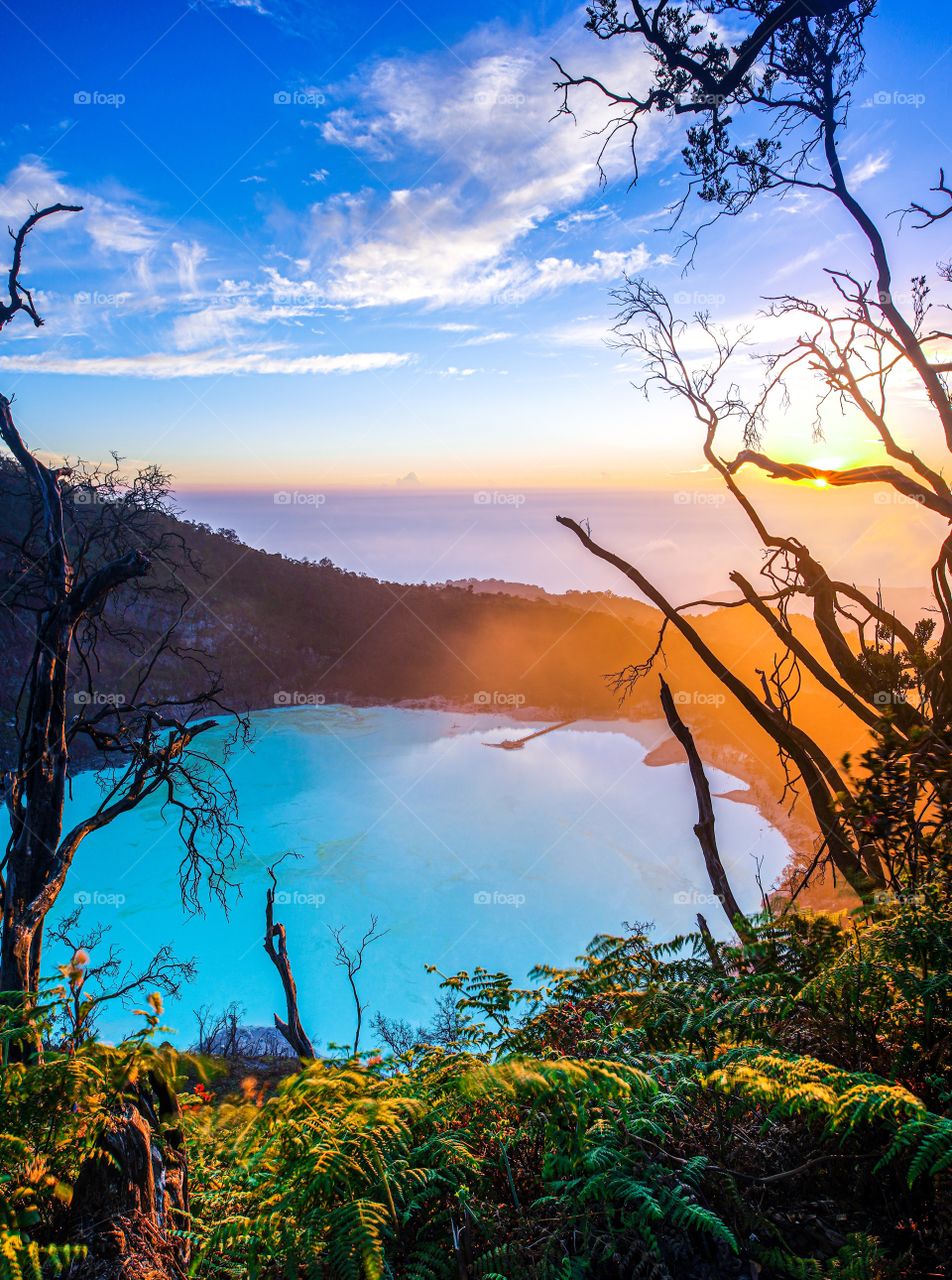 This blue lake is called Kawah Putih, a volcanic lake left over from the eruption of Mount Patuha in South Bandung
