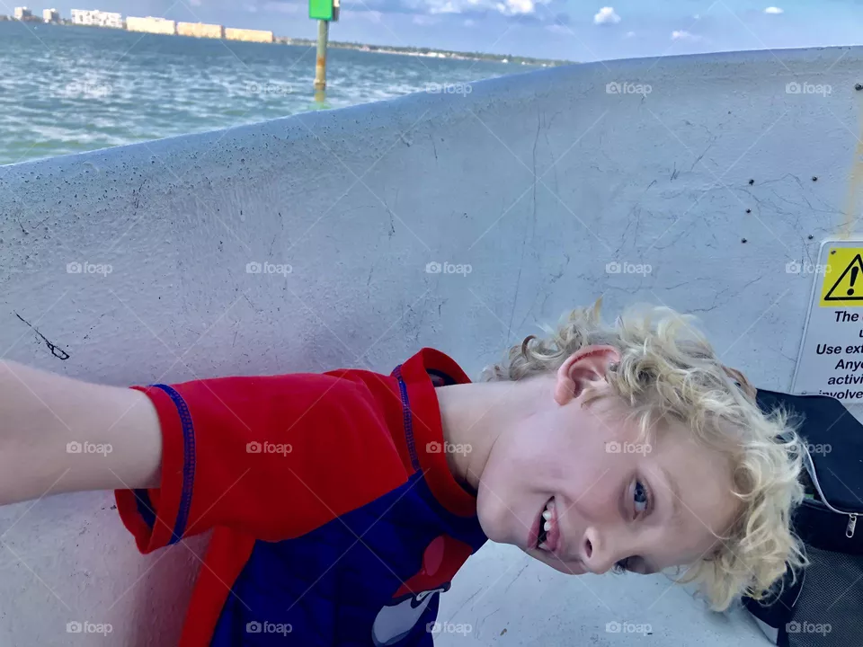 Boy in motion on a boat ride