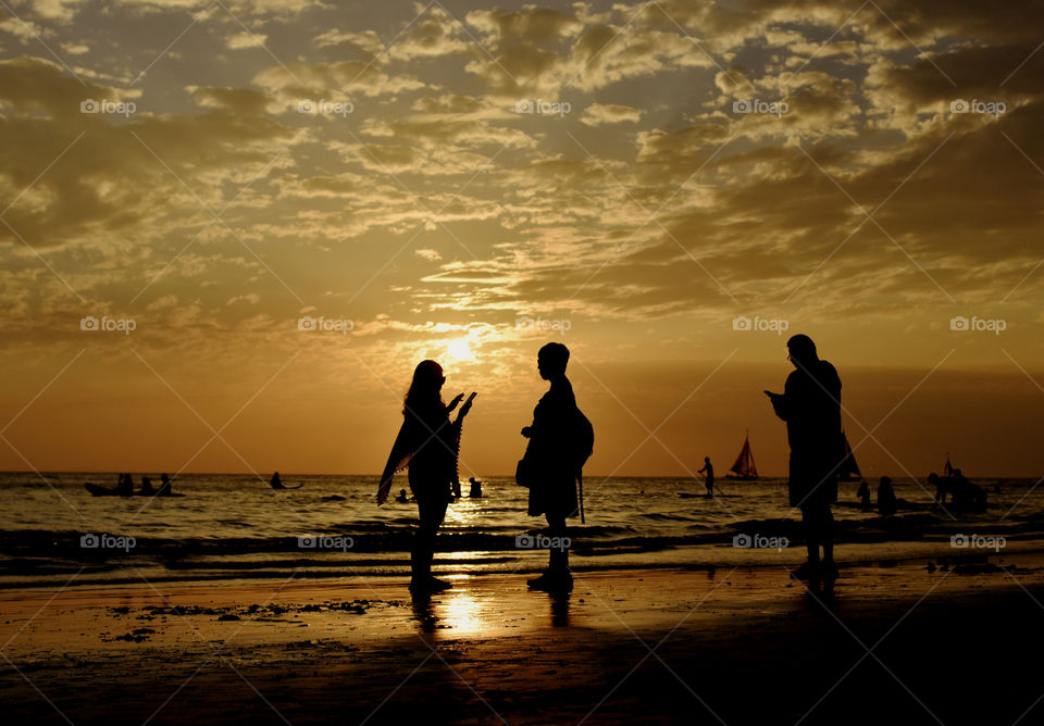 Sunset in Boracay Island Philippines.
Sitting by the shore waiting for the sun to set, observing tourist as they take a photo is the best way to end the day.