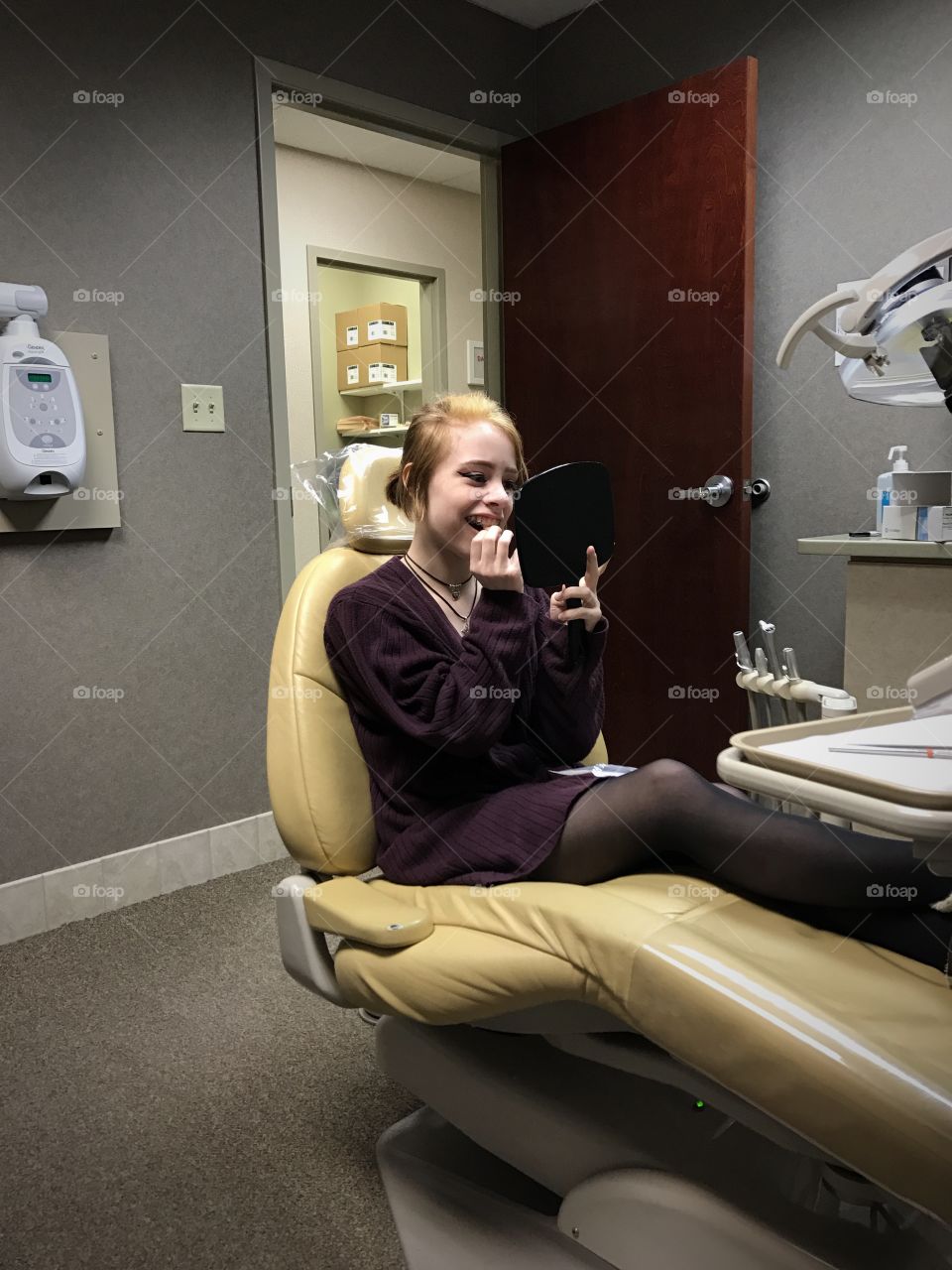 Teenage girl in dental clinic