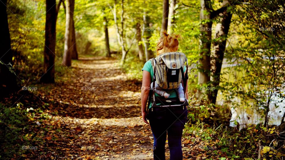 Hiking with baby in a carrier. Enjoying the fall foliage