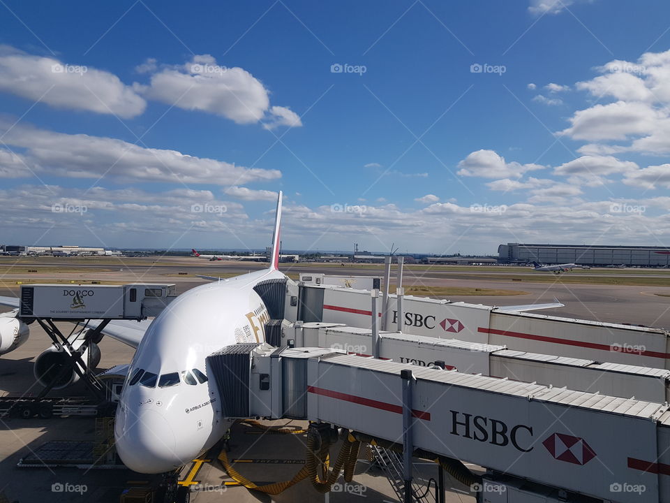 An Airbus A380 operated by Emirates Airline on the stand at Heathrow Terminal 3, London.