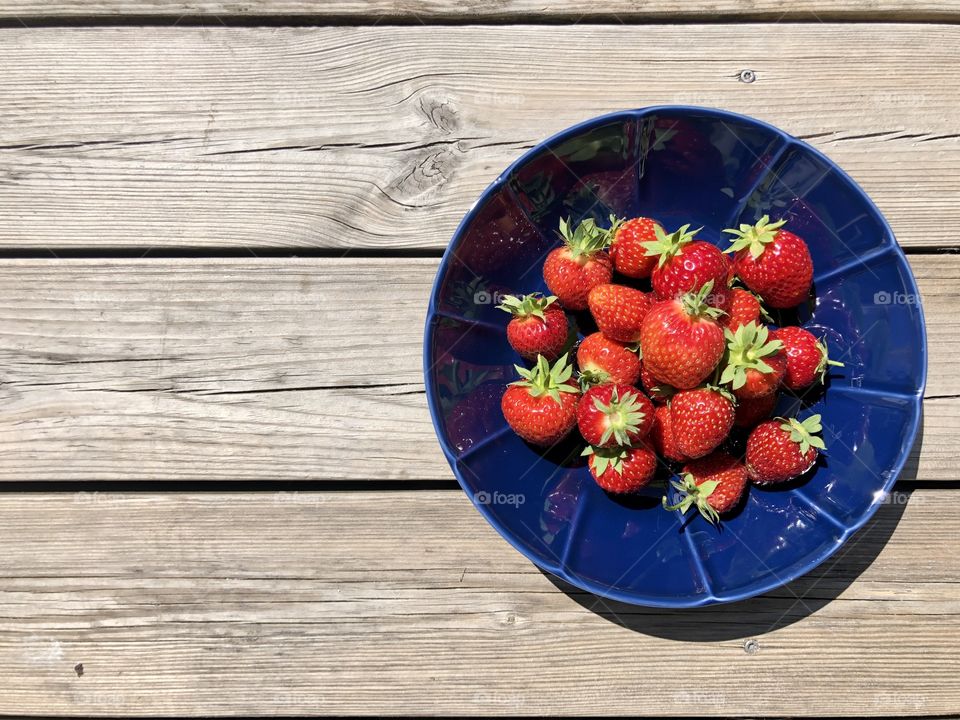 Blue bowl of red summer gold