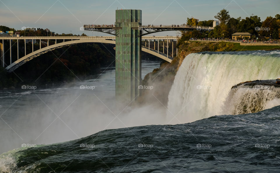 People at an observation deck overlooking Niagara Falls