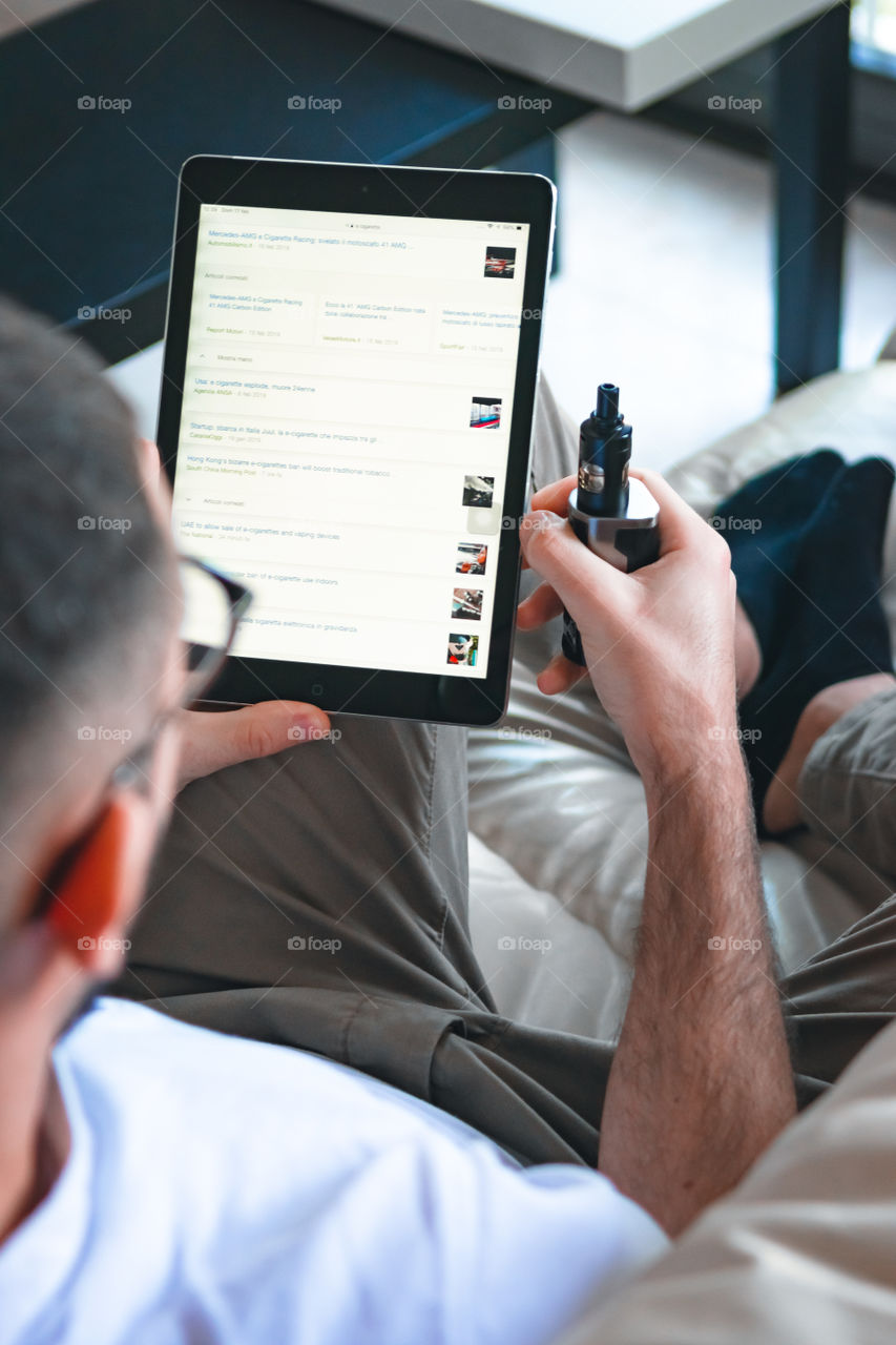 Man smoking while relaxed at home