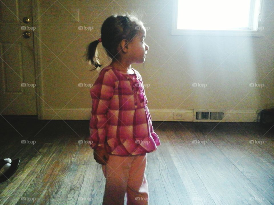 Cute girl standing in house