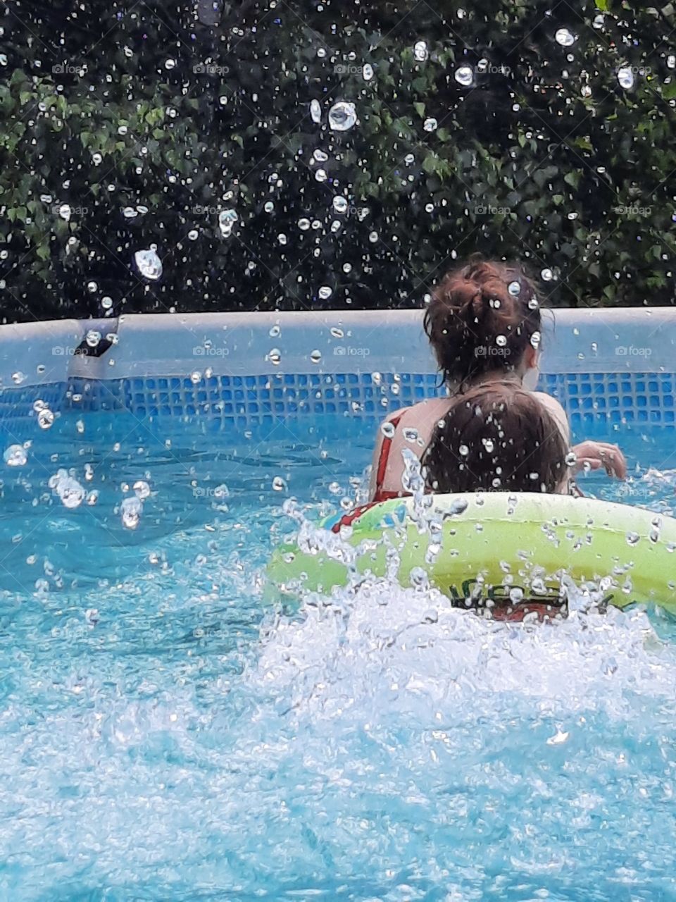 splash - kids swimming in swimming pool