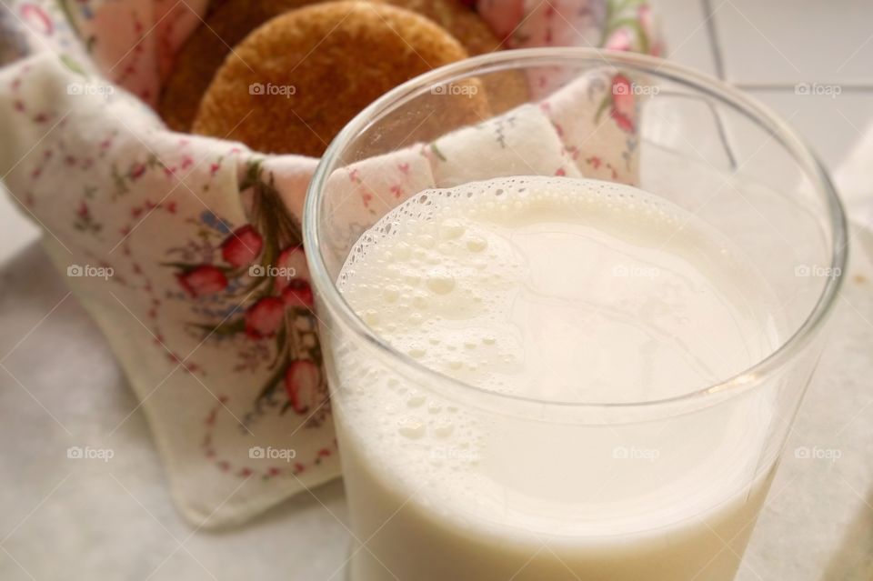 A glass of cold milk and some homemade snicker doodle cookie biscuits