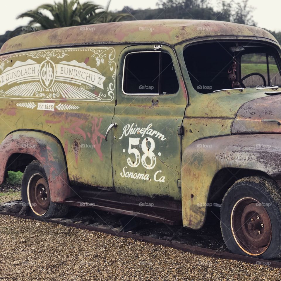 Build character, just like the rusted exterior of the antique car that guards the entrance of a California vineyard. 