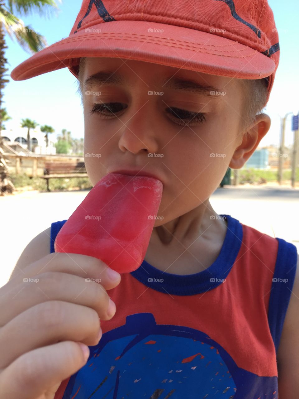 A kid eating a Popsicle 