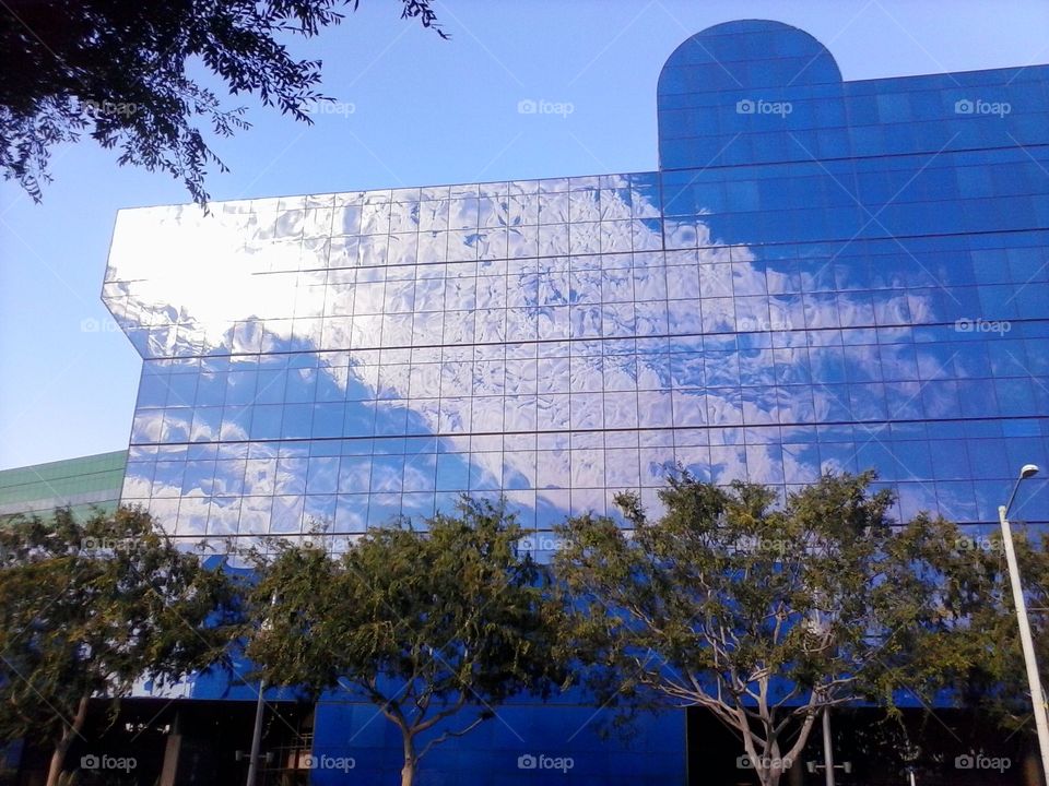 Blue sky and clouds reflected on Pacific Design Center’s Blue Building.