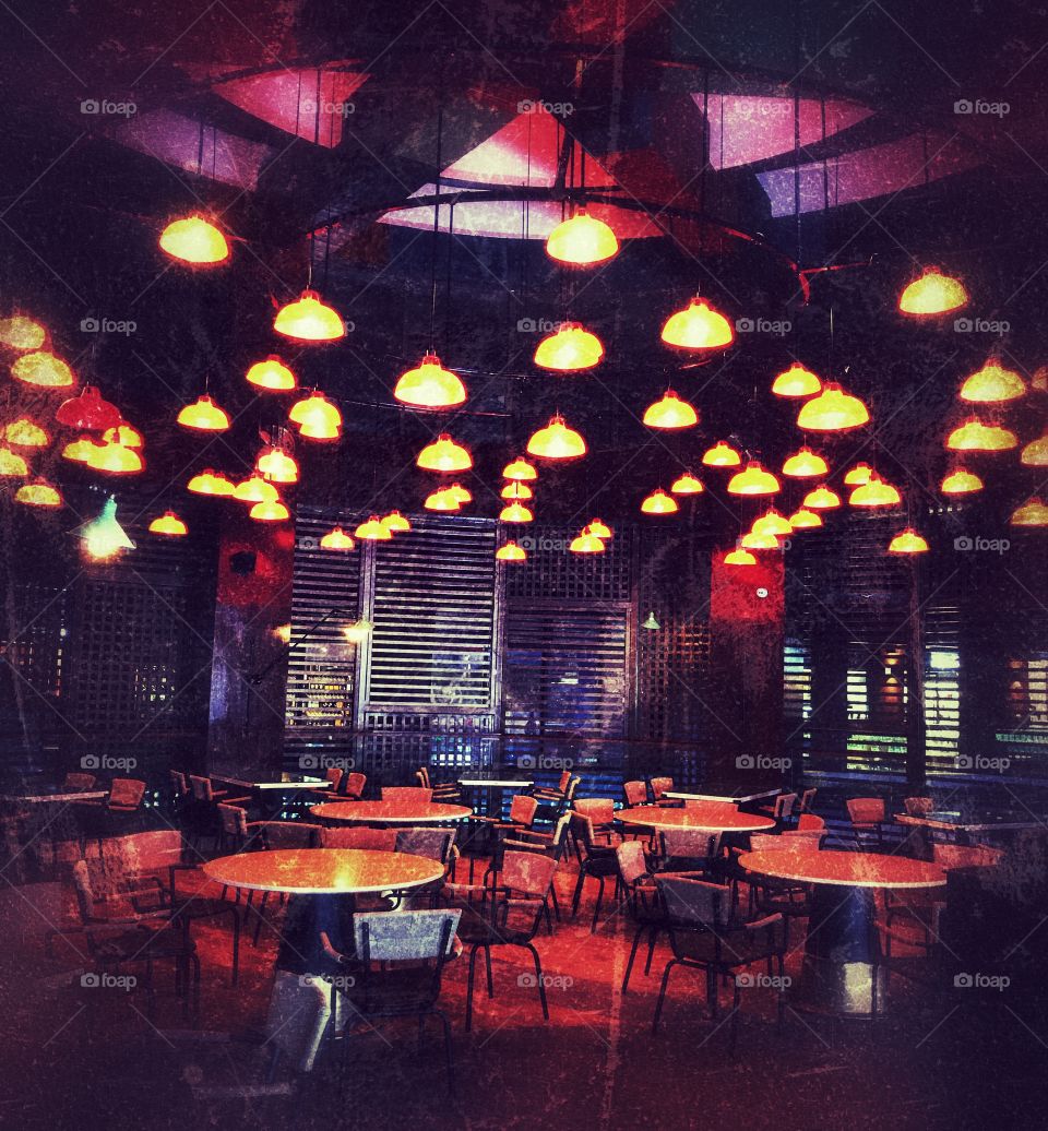 Many lights, many tables and chairs....and NO people...