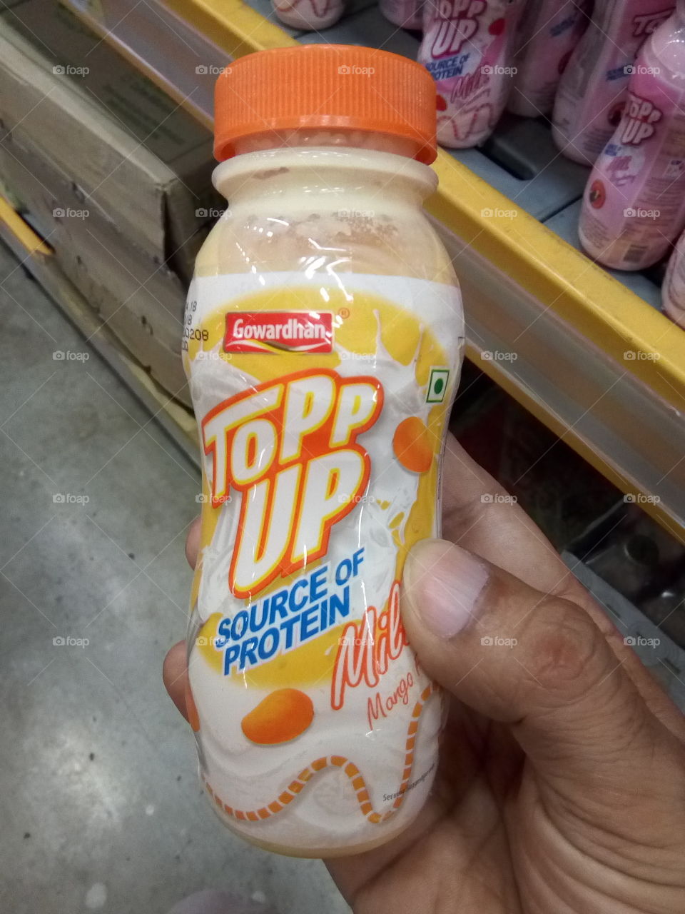 Topp up mango flavor milk. A source of protein.