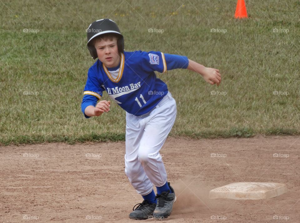 Love Running. Young Baseball Runner
