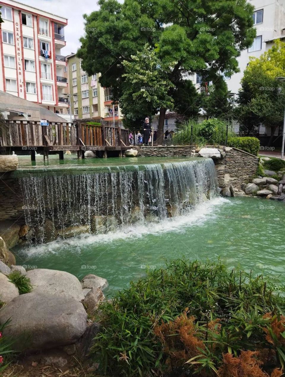 That waterfall looks absolutely breathtaking! The cascading water, the gentle stream, and the lush trees create such a picturesque scene. It's like a hidden paradise in the midst of nature's embrace.