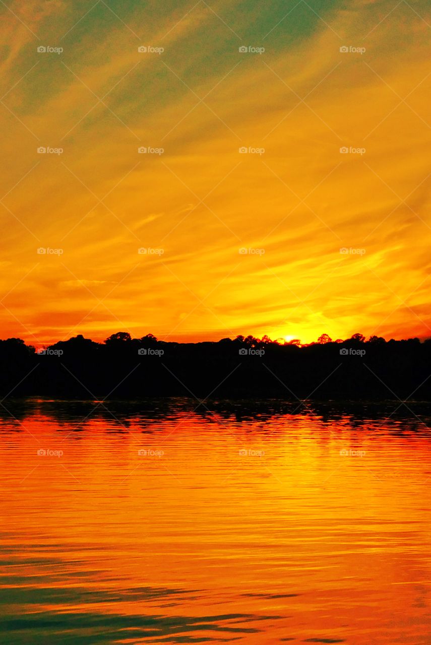 The bay had turned brilliant orange and the sky was streaked with the most beautiful sunset I had seen! Amber and tangerine beams were thrown into the dusty sky, its beautiful colors embracing the heavens gracefully!