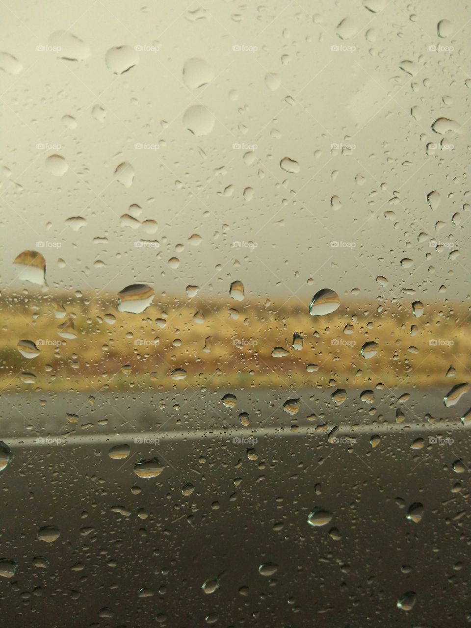 droplets on a window desert scene