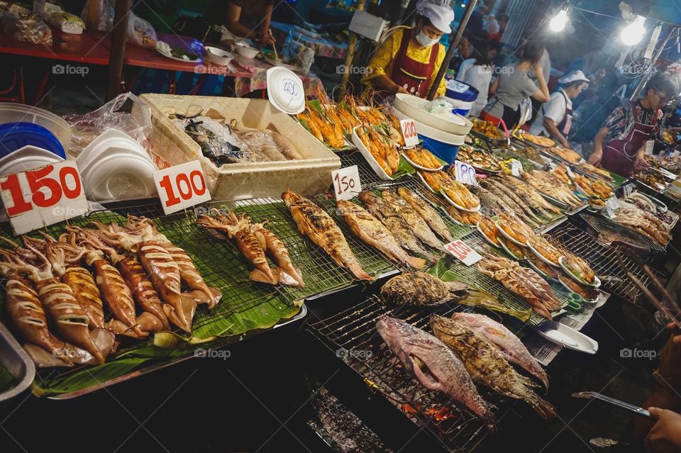 Grilled seafood stall at a night market in Chiang Mai, Thailand
