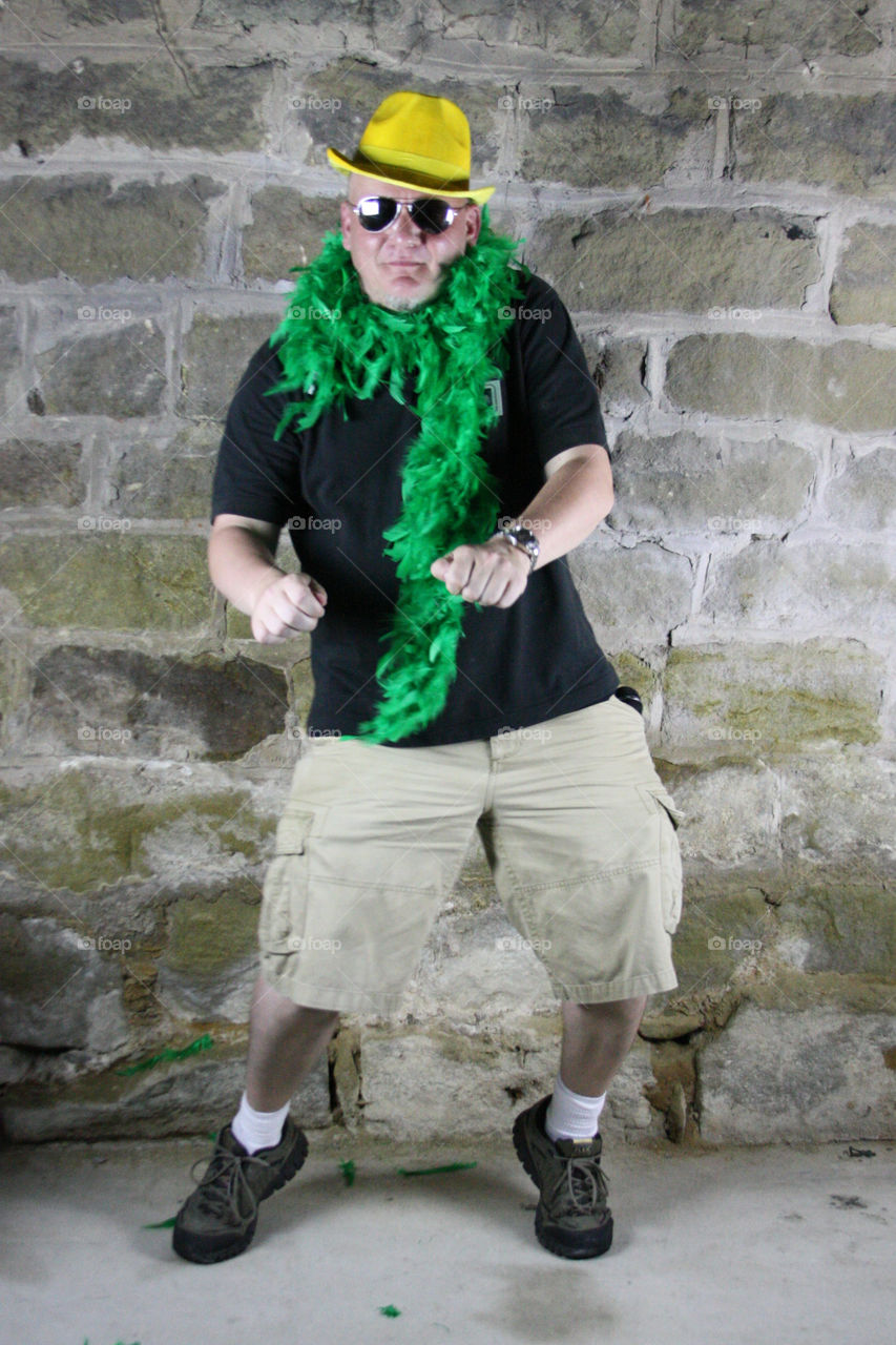 Mature man with green fur scarf