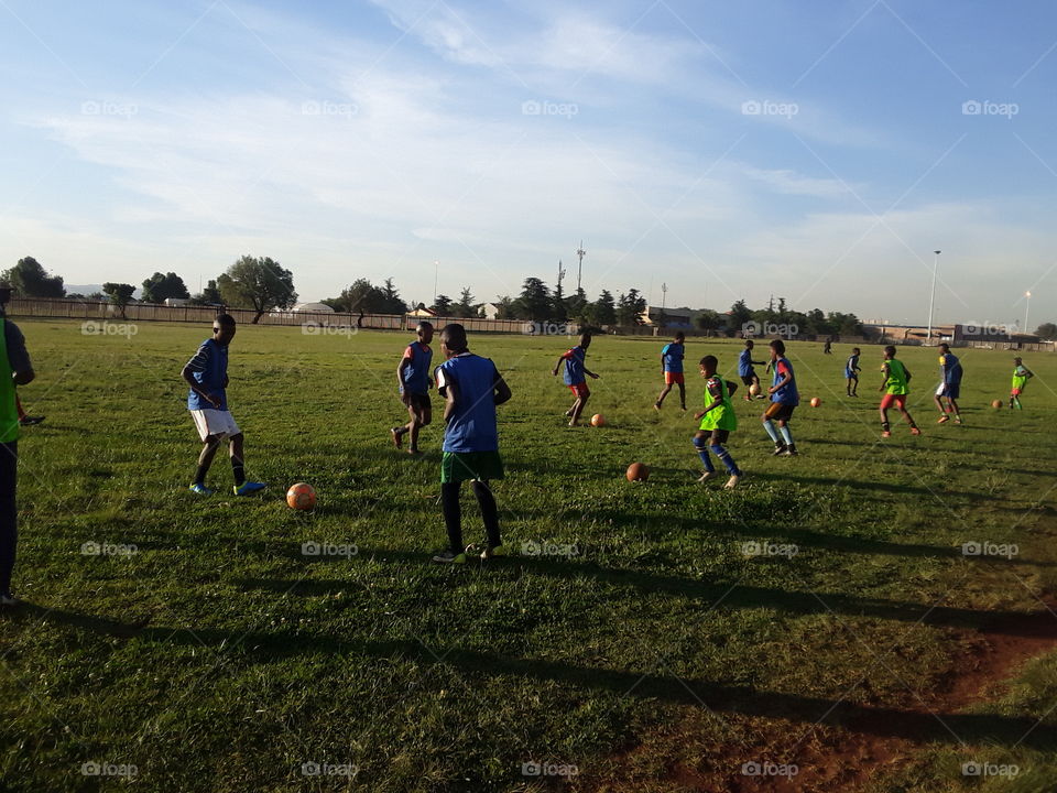 Football players are practicing for their skills.