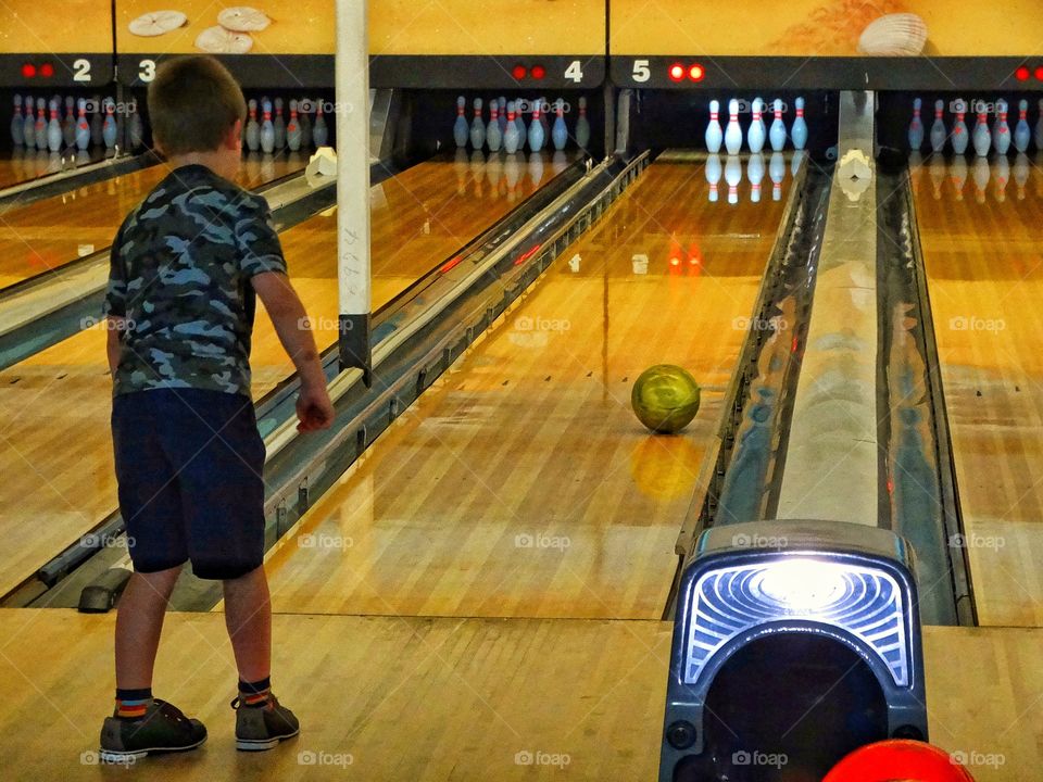 Boy In A Bowling Alley