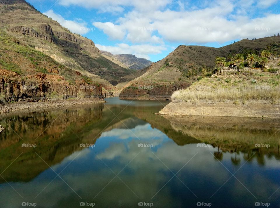 Reflection of mountains and clouds