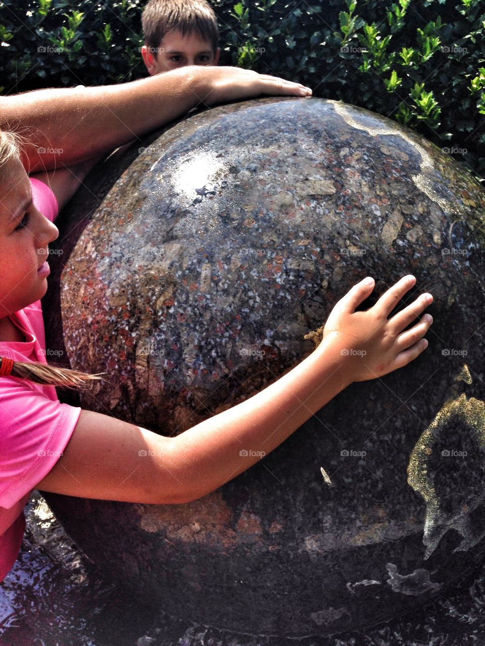 Summer fountain. Playing in a ball water fountain