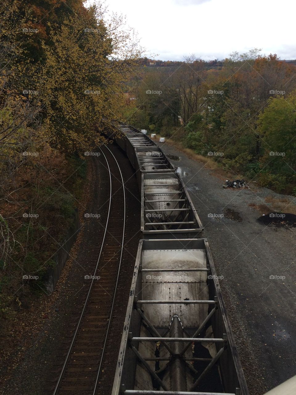 Train Under the Bridge. Taking a walk back home.