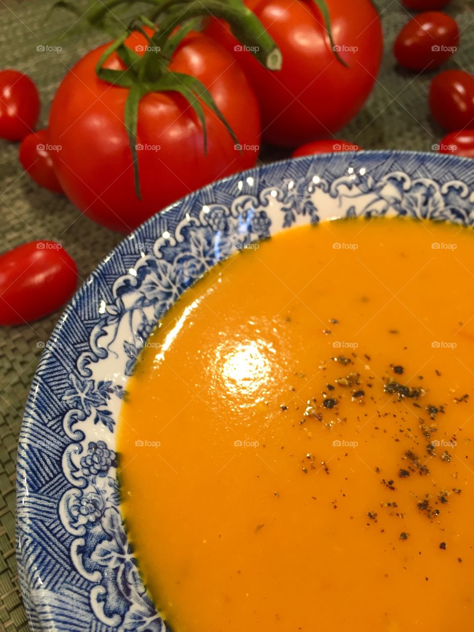 Tomato soup in an English style blue plate
