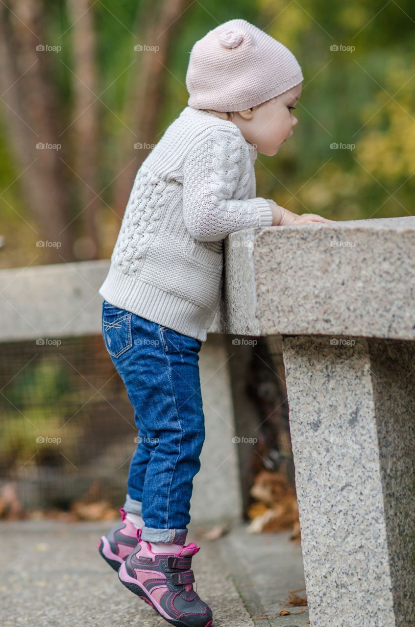 Side view of a child leaning ahead
