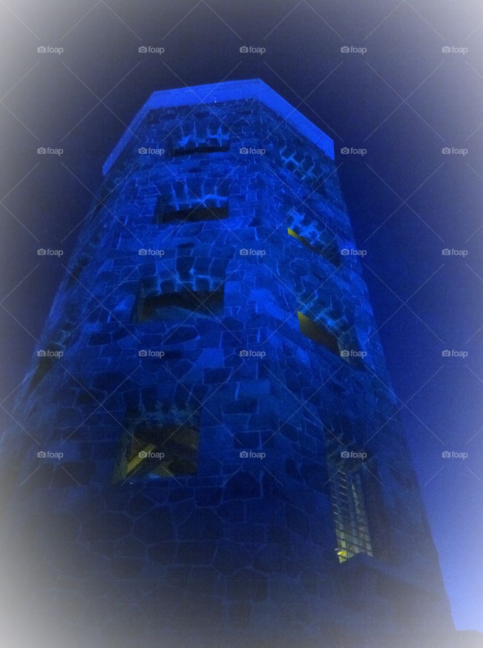 Looming tall. Looking at an old tower