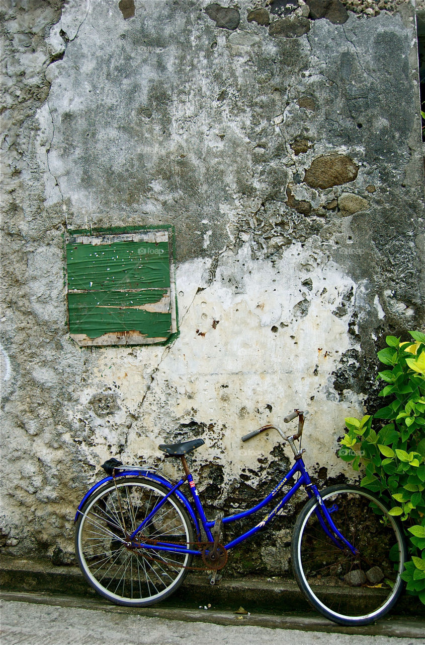 bicycle blue stone wall street photography by miake