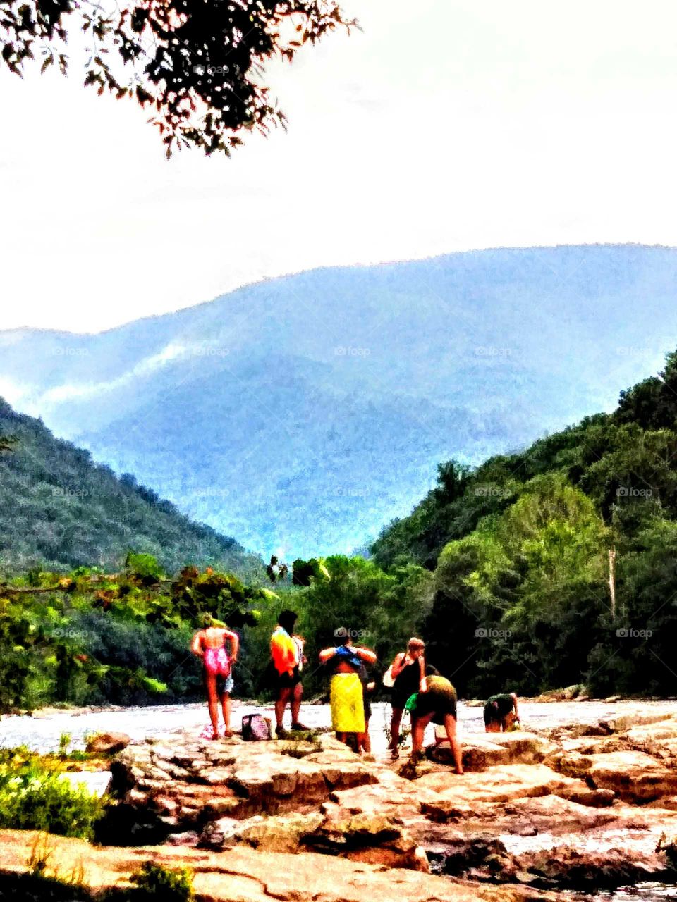 People having fun at the river in the summer.
