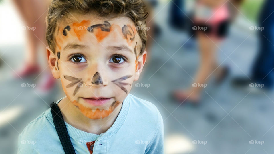 festival fun. face painting at a local festival