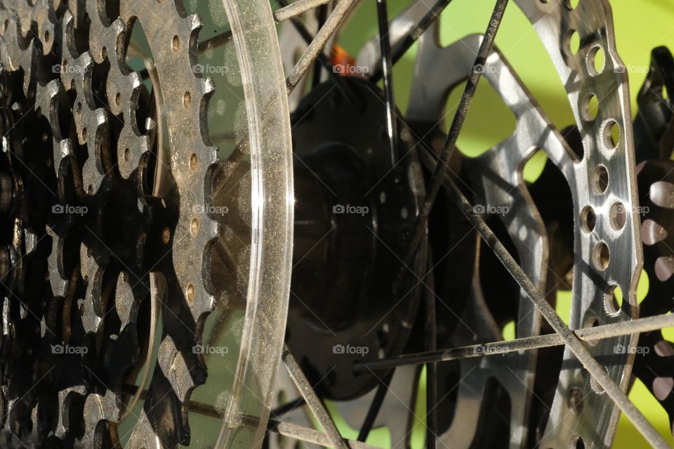 Bicycle components, parts of drive train, disk break and spokes.