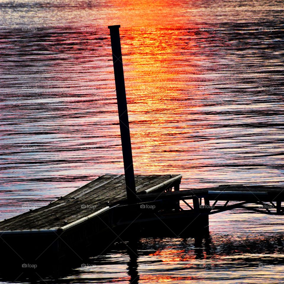 Lake sunset by the dock. 