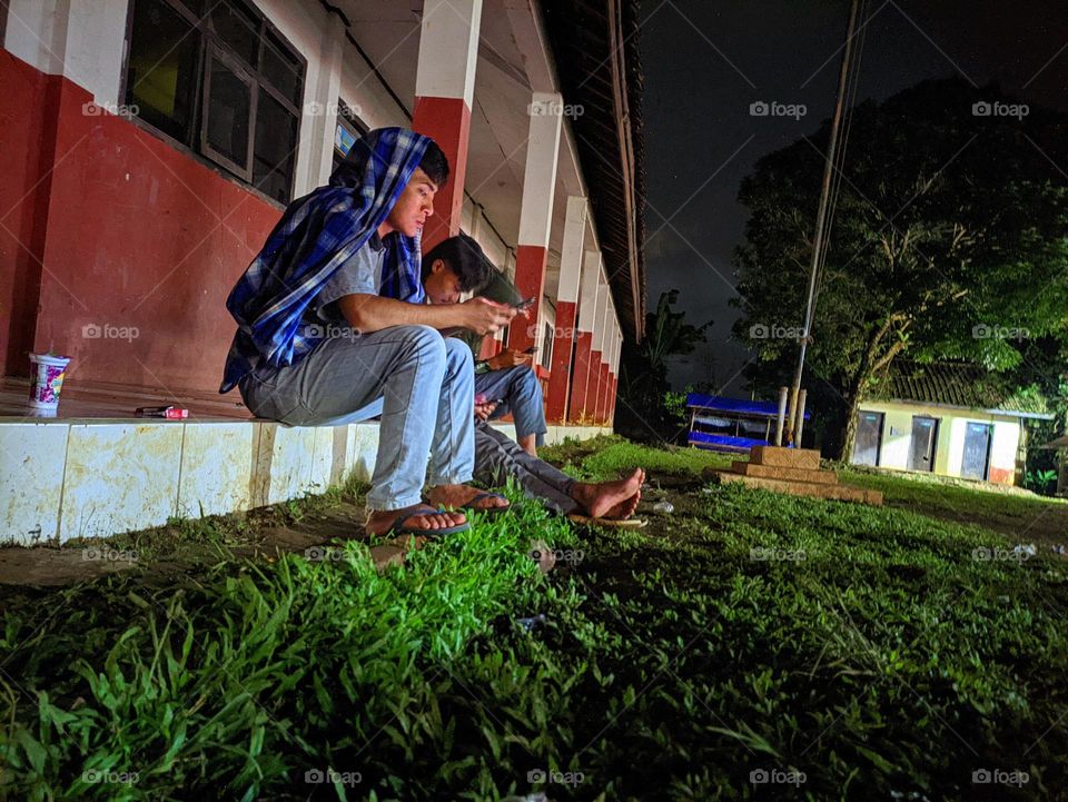 enjoy the atmosphere of the night outside the elementary school