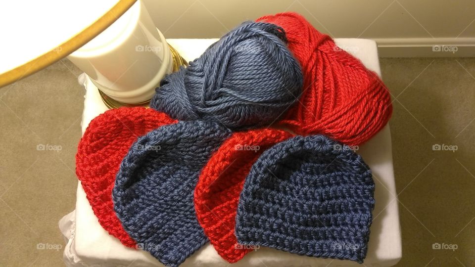 Red and blue hats and yarn