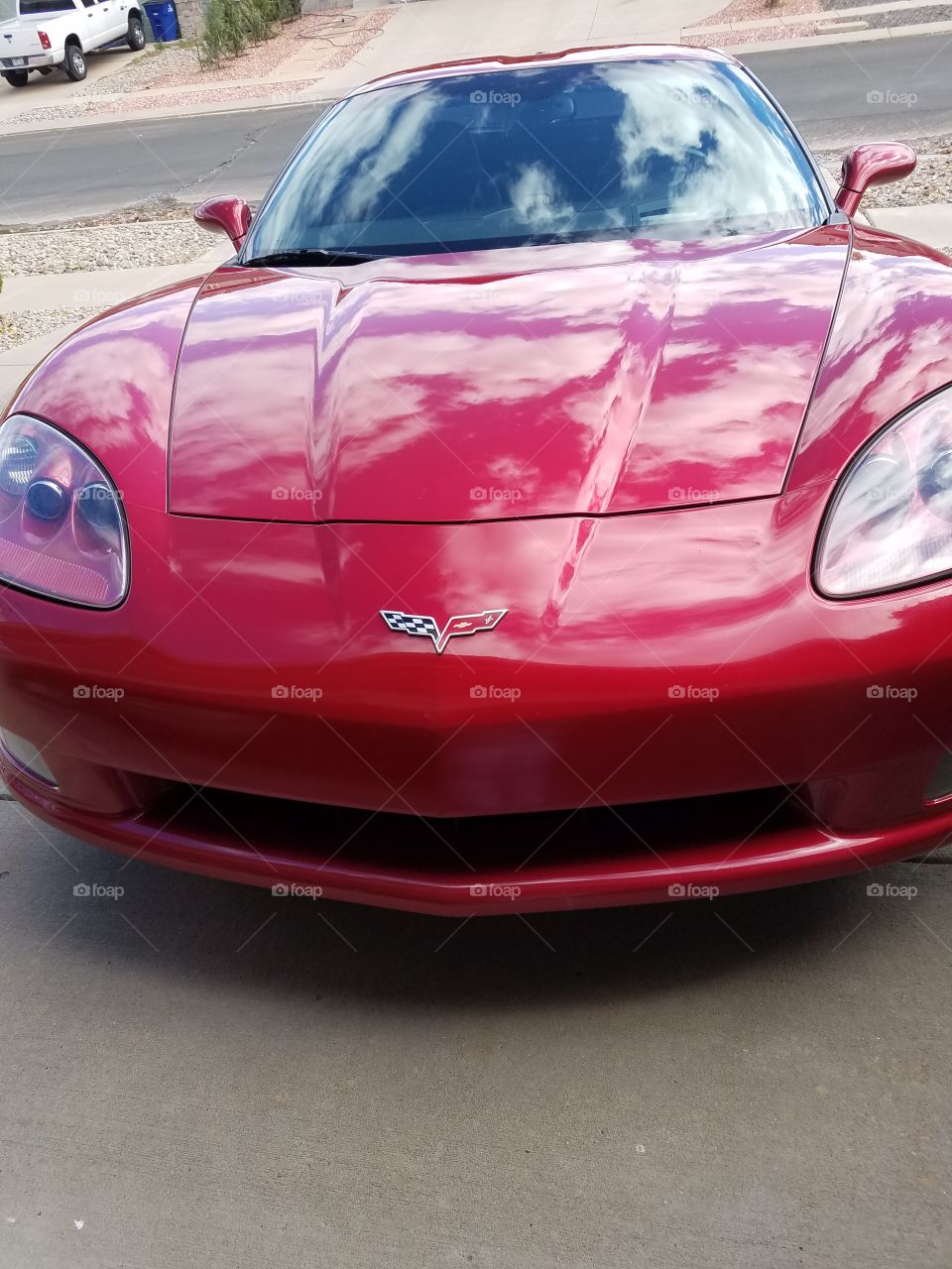 Close-up of red car near street