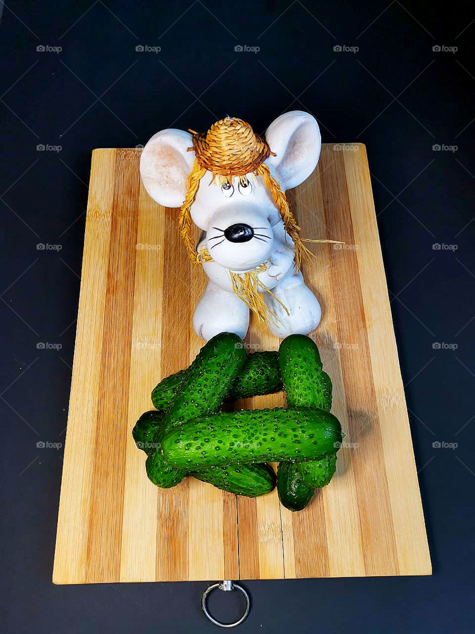 Cucumbers and figurine mouse