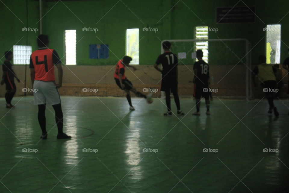 A stop action photo from a futsal player